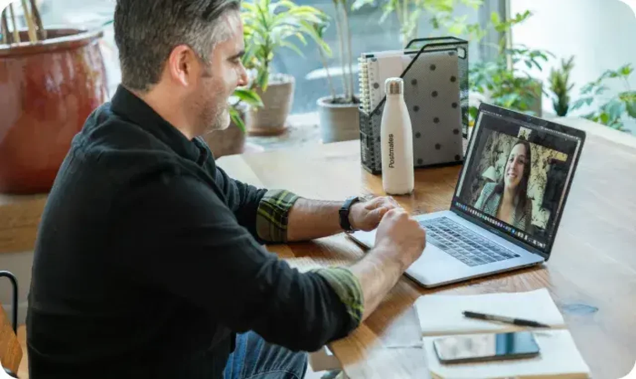 man-in-black-sweater-using-macbook-pro
